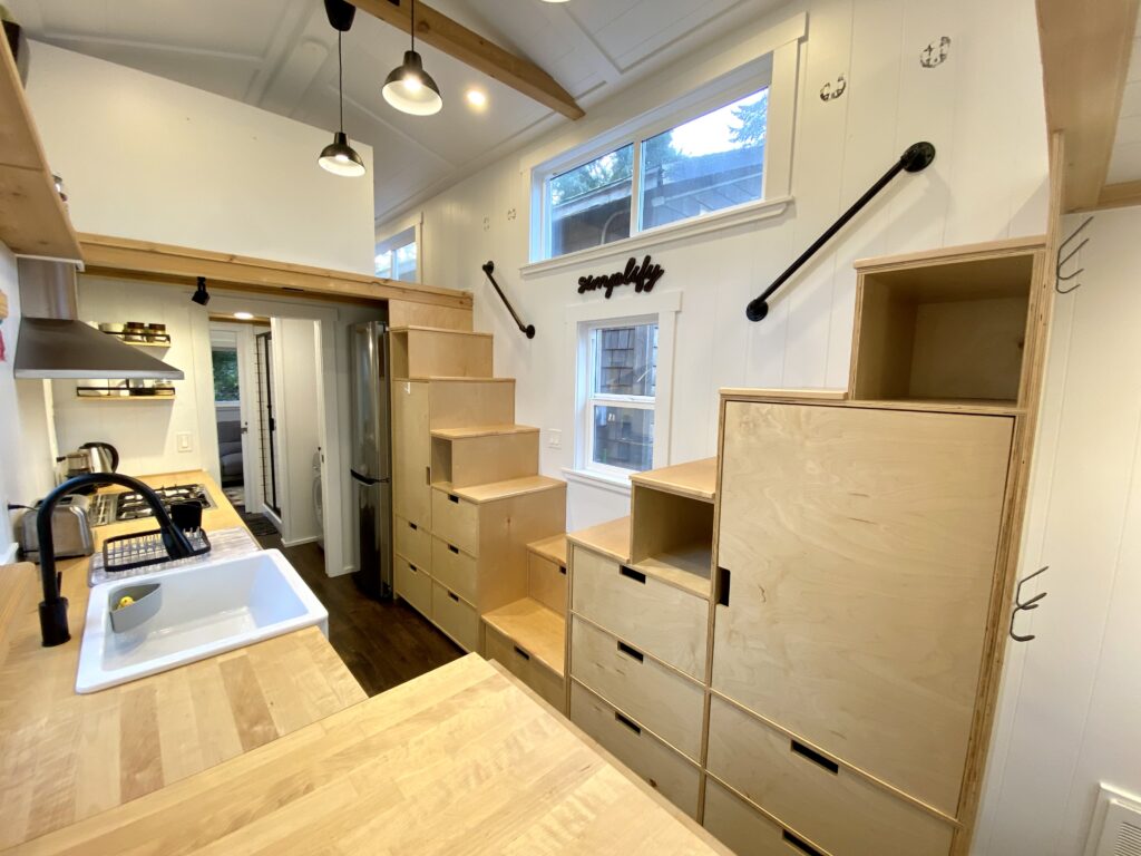 Tiny home requiring stair cabinetry, storage couch and living room shelving.
